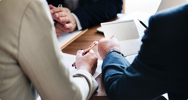 Financial advisors reviewing document